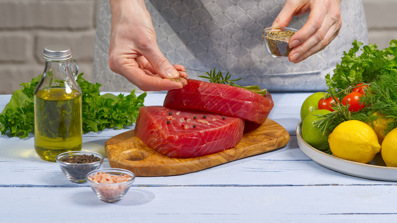 preparing tuna steak for marinating