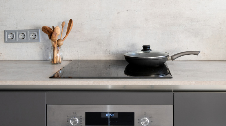 A tidy kitchen with a sleek, built-in induction range