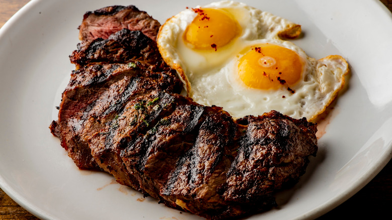 sliced steak and eggs