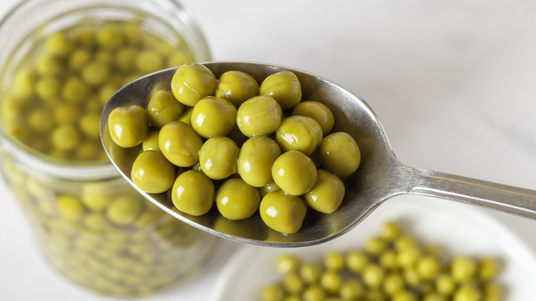 canned peas in spoon