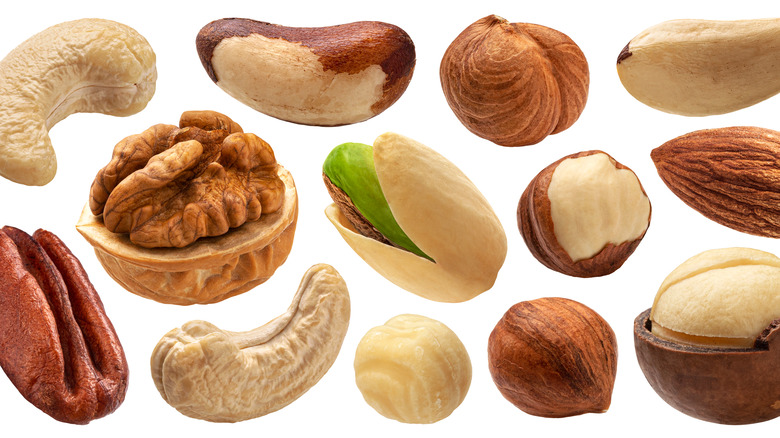 various nuts against white background