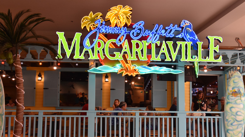 Jimmy Buffet's Margaritaville sign and diners in Minnesota
