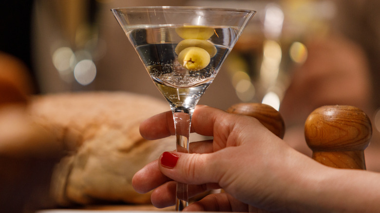 Hand holding a martini