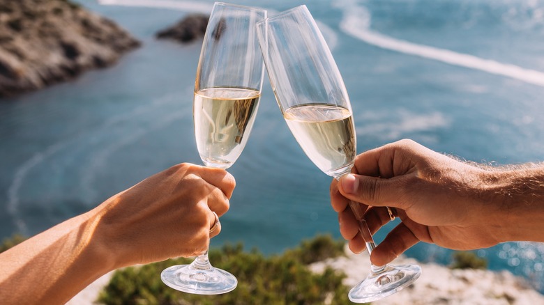two people toasting with champagne