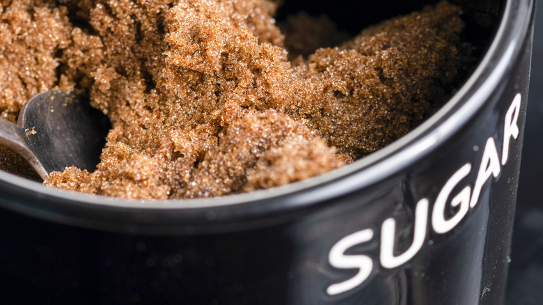 brown sugar in black container