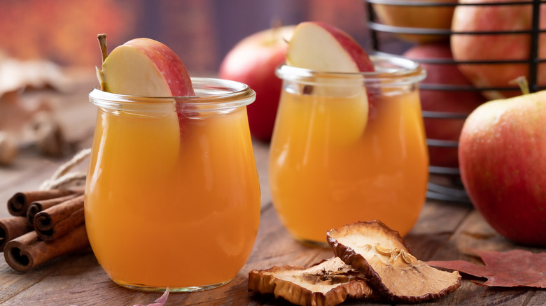 Apple juice glasses with apple slices