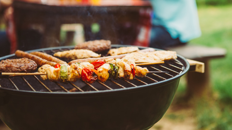 veggies on a grill with meat