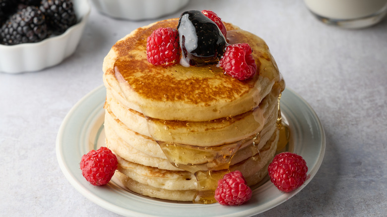 Fluffy pancake stack with fresh berries