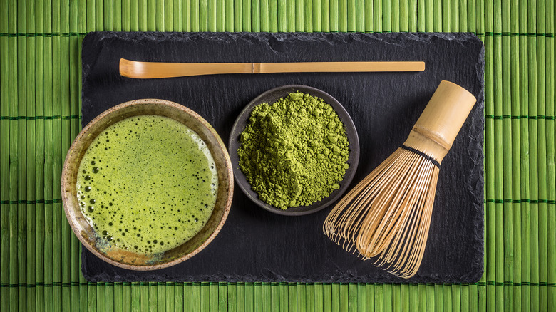 matcha and powder in bowls whisk