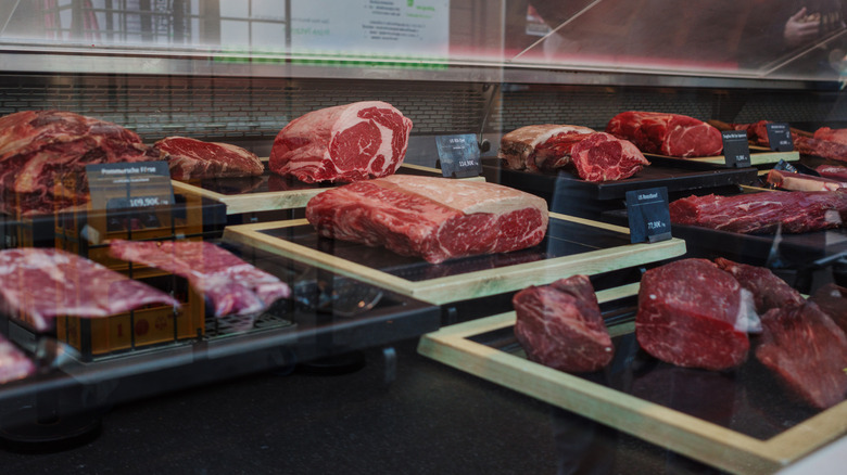 display fridge of meat cuts at a butchers shop