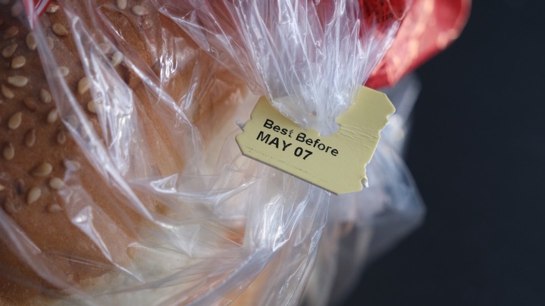 A bag of bread closed with a tag that says "Best Before May 07"