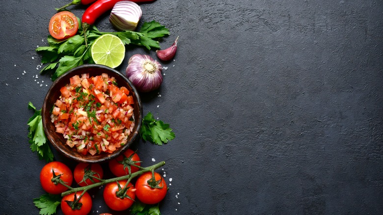 Bowl of salsa and ingredients