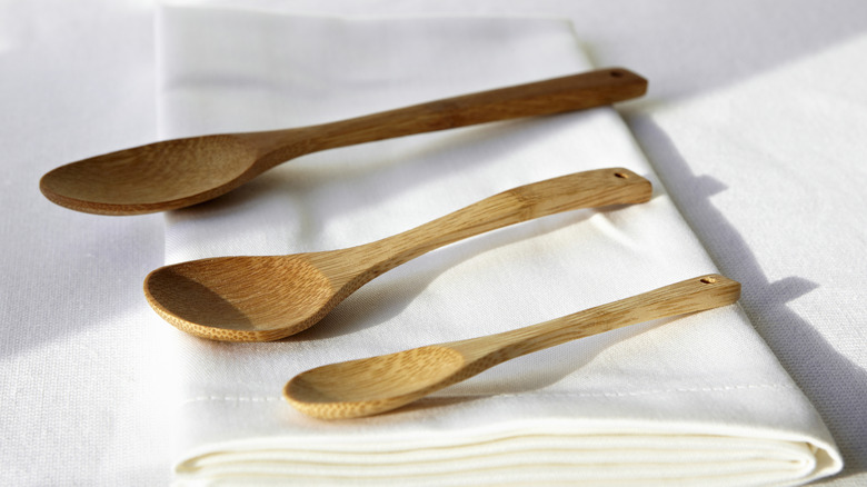 Wooden spoons on white napkin