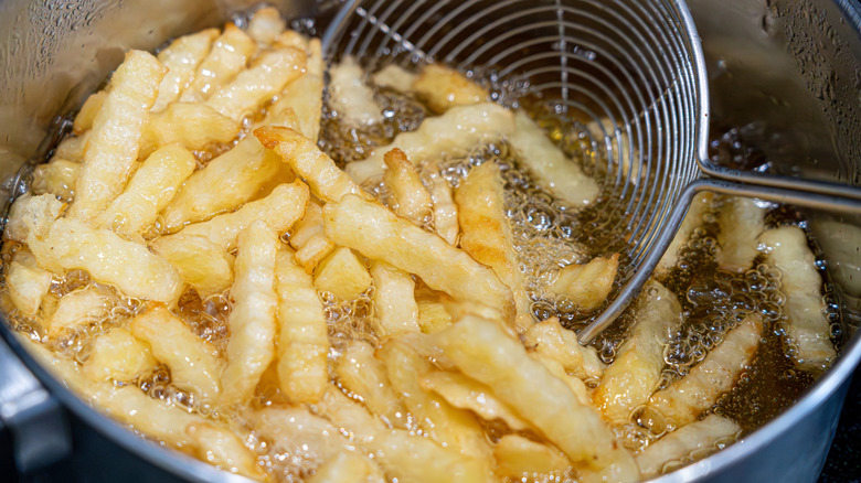 Fries cooking in oil