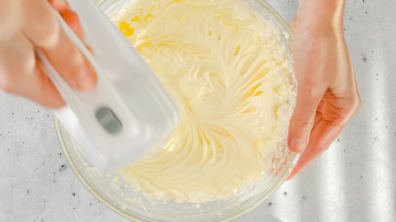 mixing cheesecake batter