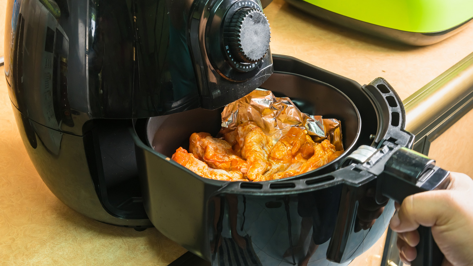 https://www.tastingtable.com/img/gallery/why-you-should-never-put-your-air-fryer-against-the-kitchen-wall/l-intro-1655215597.jpg