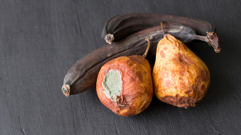 Rotten bananas and pears