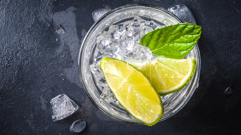 limes and ice in glass