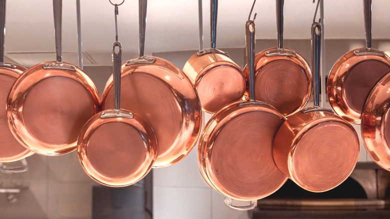 Hanging copper pans gleam