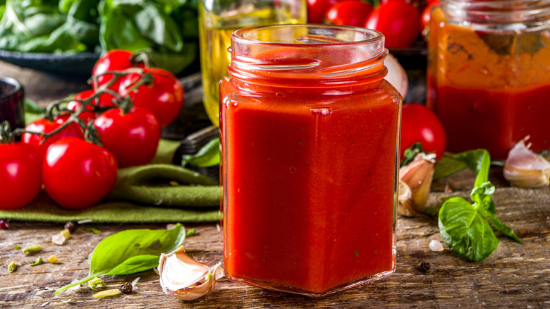 jar of pasta sauce with tomatoes and oil