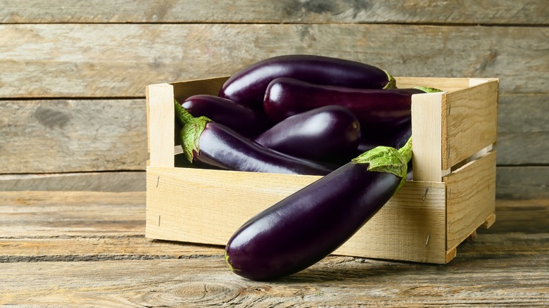 Eggplants in wooden box