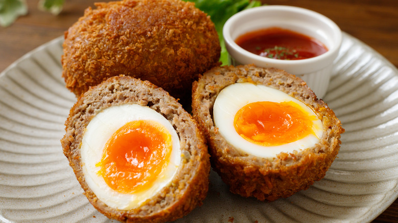 whole and halved Scotch eggs