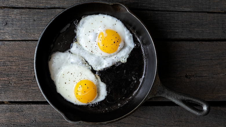two fried eggs in skillet