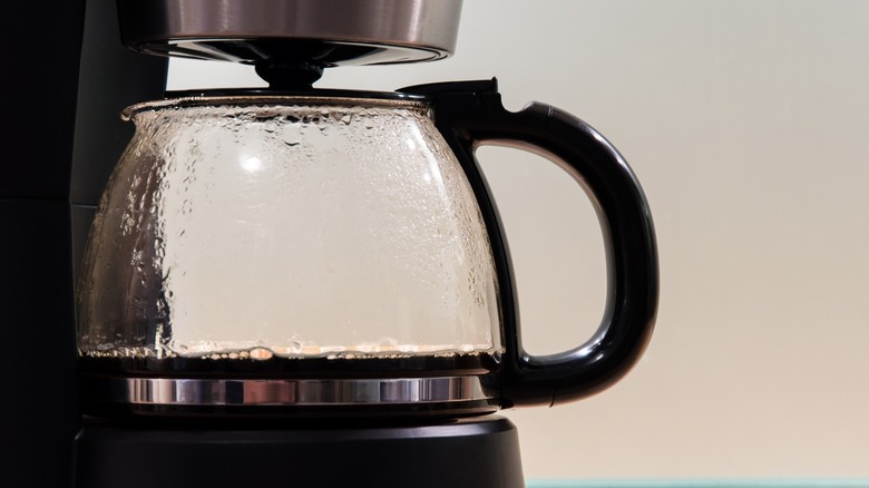 Close-up of a drip coffee maker carafe and hot plate