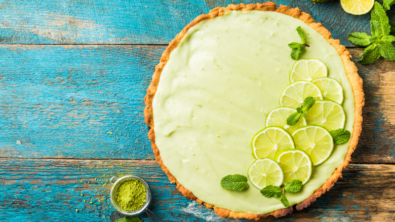 whole key lime pie on wood