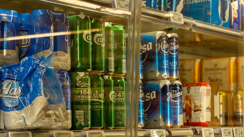 Various Norwegian beer cans on store shelves