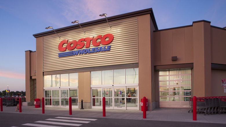 The front doors of a Costco at dawn