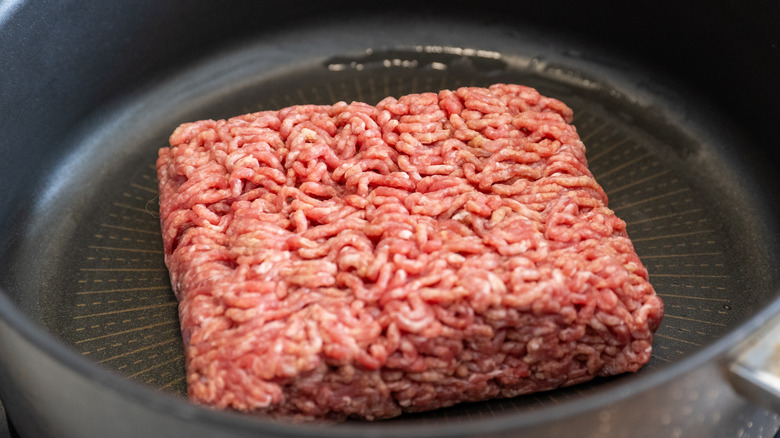 Raw ground beef in a pan