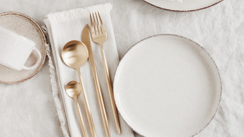 white place setting with silverware