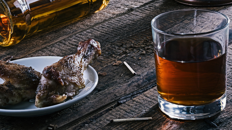 Bourbon  with chicken bones and bottle on side