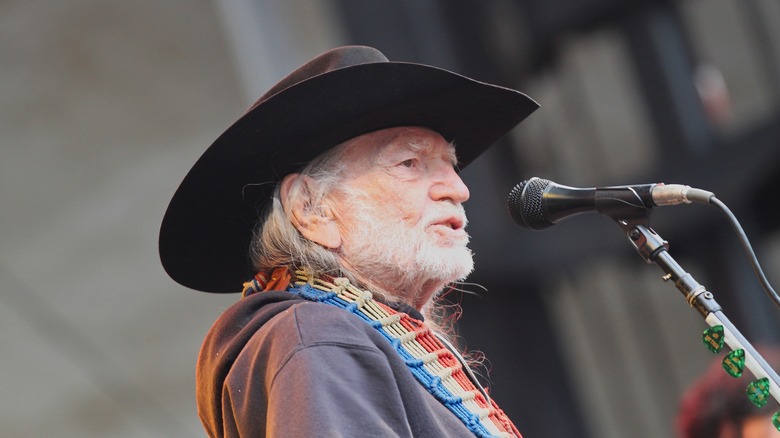 Willie Nelson croons on stage