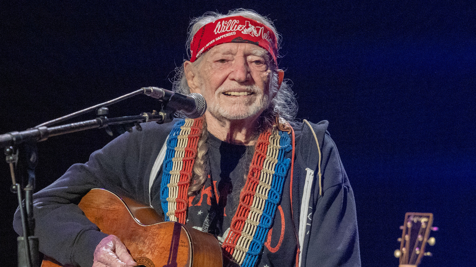 The Willie Nelson Connection Behind Texas Roadhouse's Armadillo Mascot - Tasting Table