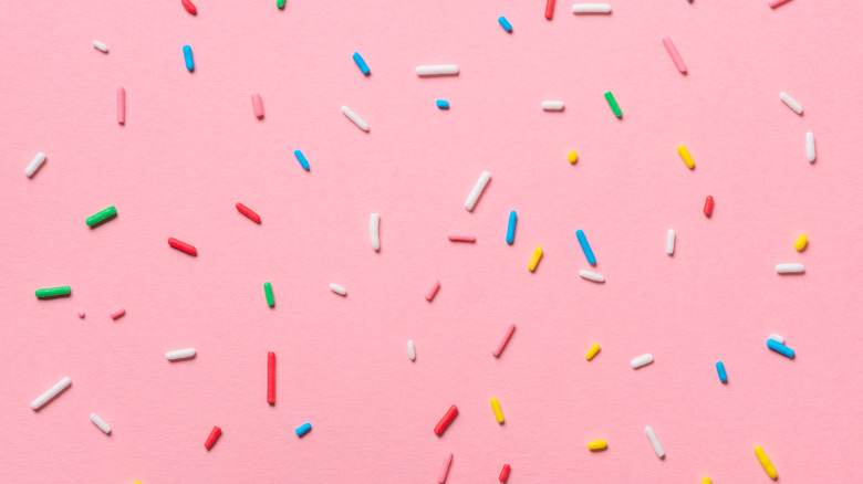 rainbow sprinkles and pink background
