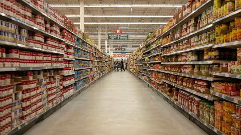 Aisles for condiments, canned vegetables and fruits, broth, soup, and etc., at a WinCo Foods Store in Tigard, Oregon.