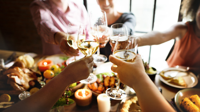 people toasting at holiday table