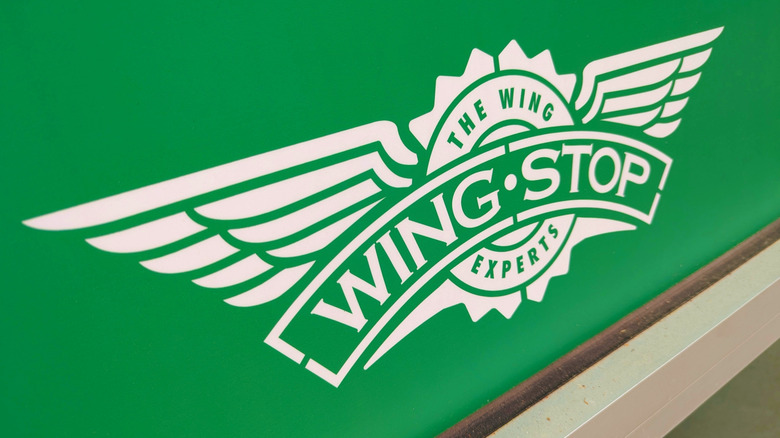 The wingstop logo on a box of chicken