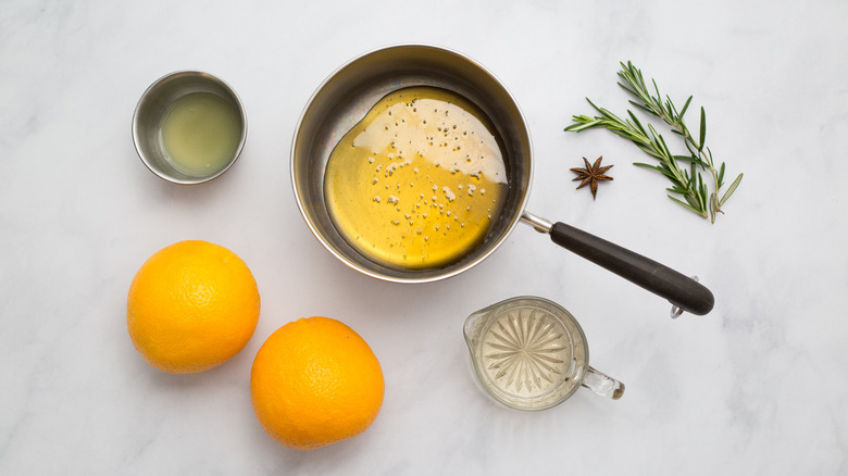orange mocktail ingredients on table
