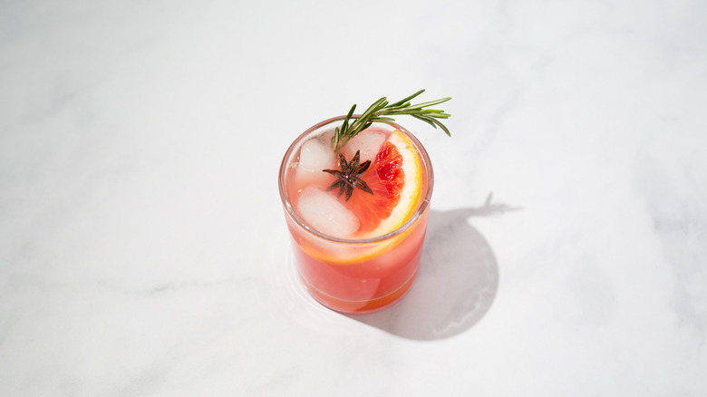 garnished orange drink on table