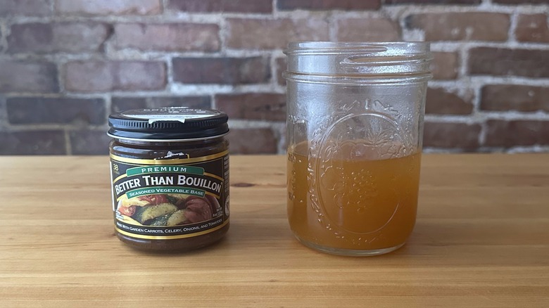 Jar of Better Than Bouillon Seasoned Vegetable Base next to broth in a jar