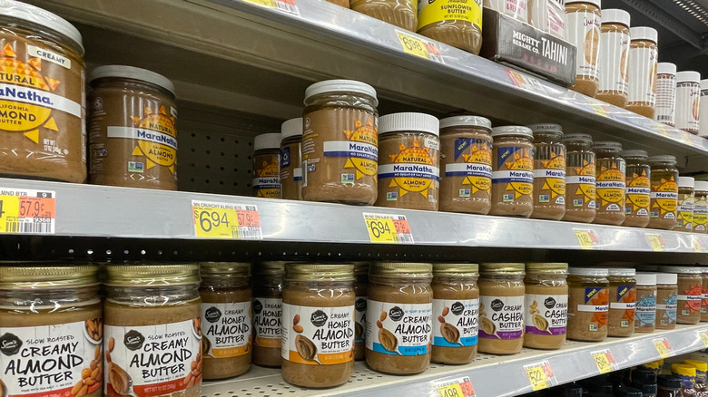 selection of almond butter in grocery store
