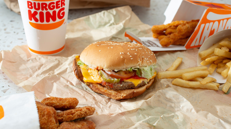burger king burger with chicken items and drink