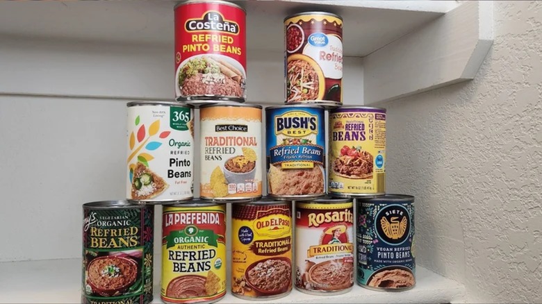 various cans of refried beans stacked up