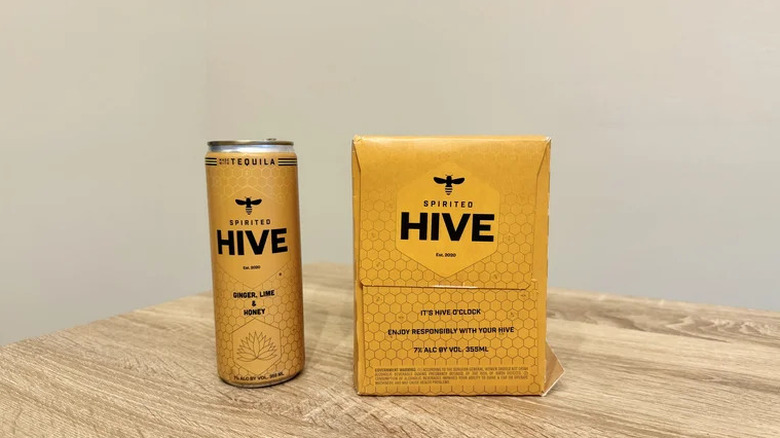 The box alongside a can of Spirited Hive ginger lime and honey canned tequila drink