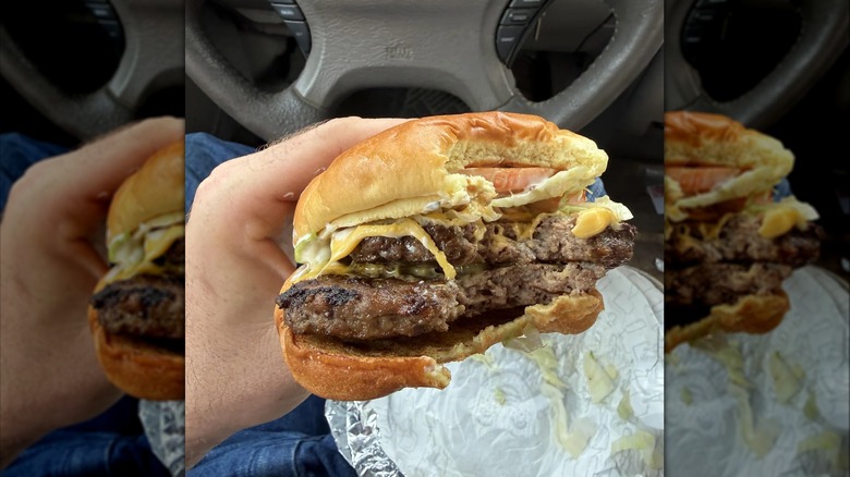 Someone holding a Wendy's Jalapeño Ranch cheeseburger
