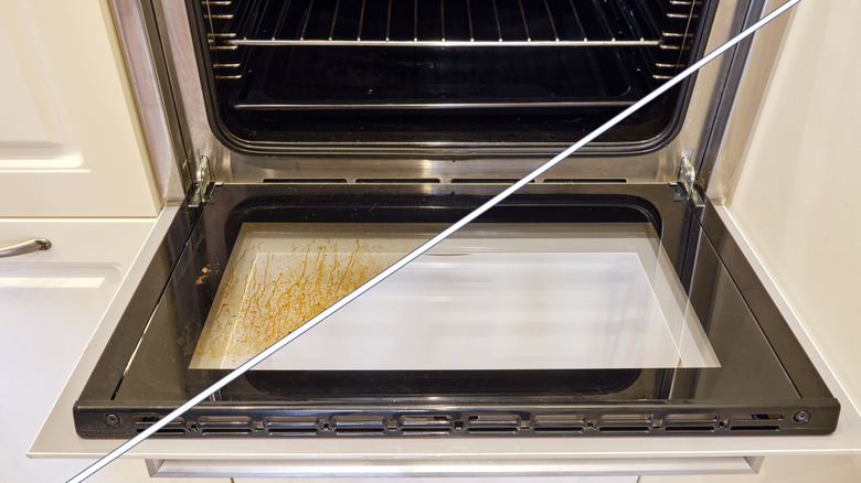 split-screen image of an open oven door showing the before and after of the window cleaning process