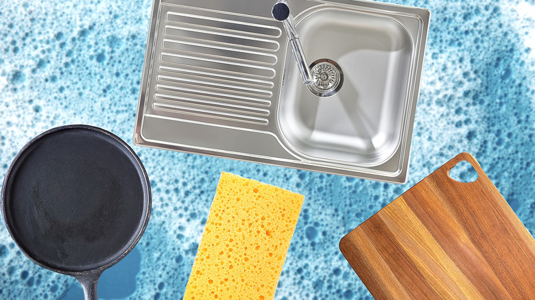 Pan, kitchen sink, sponge, and cutting board against blue soapy background